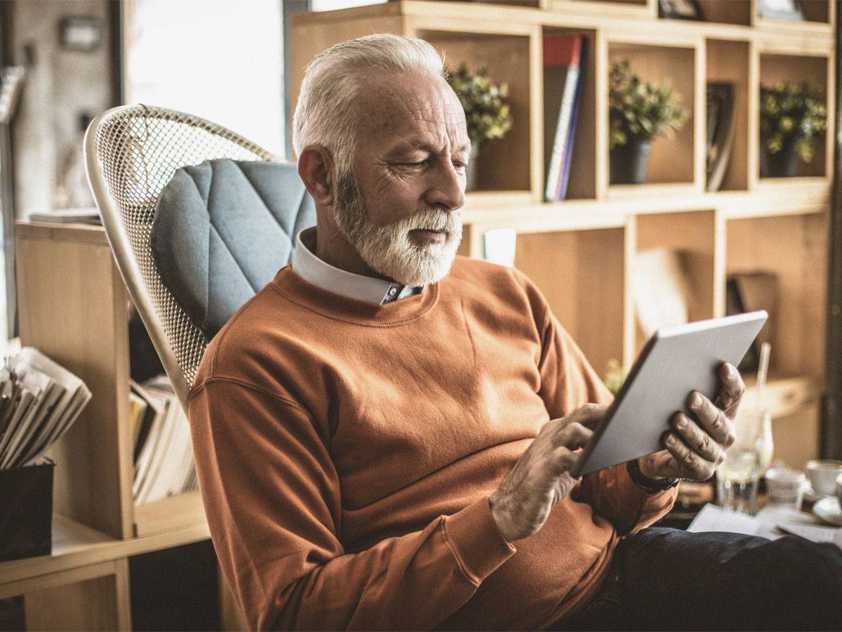 Elderly man on tablet