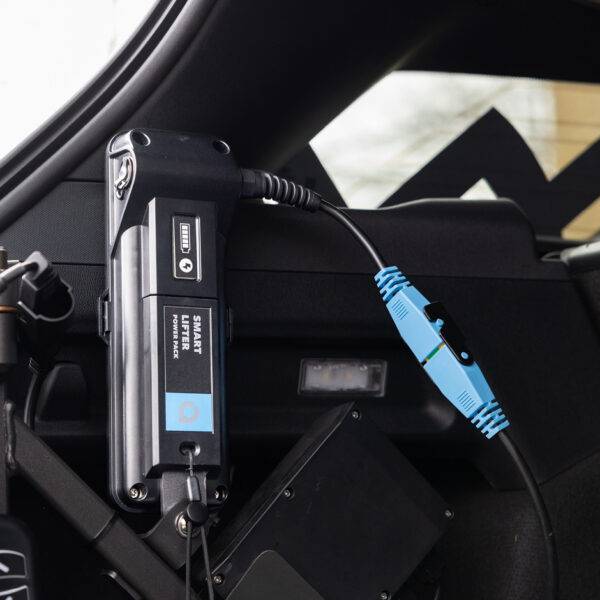 Smart Lifter Power Pack - Battery for Boot Hoists attached to a frame in the boot of a car