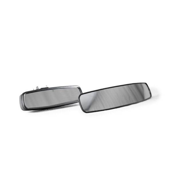 A panoramic rear view mirror for a car. It is next to a car's original mirror and it is much wider.