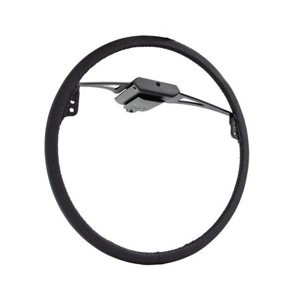 An Over Ring accelerator control for a car. It is a thin black ring connected by a control box to attach to a steering wheel.