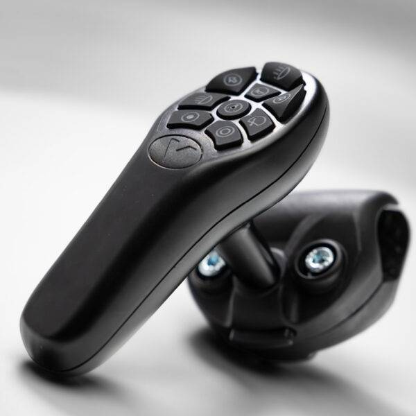A steering aid with a keypad for controlling a car's secondary functions and its bracket for attaching to a steering wheel