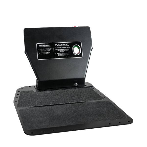 A Quick Release Pedal Guard. A metal plate for the floor of a car's footwell. It is supporting a guard to cover and protect the car's pedals.
