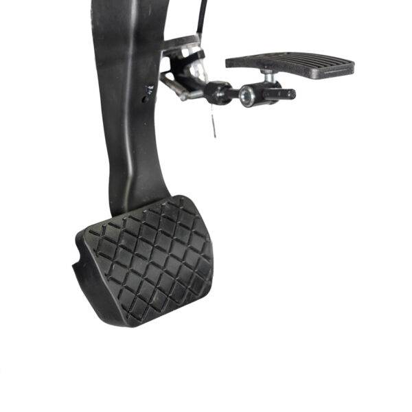 A Hinged Accelerator Pedal. The accelerator is folded up and out of the way.