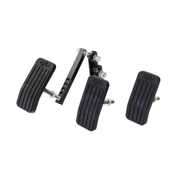Three extended pedals and their brackets to connect to a car's pedals