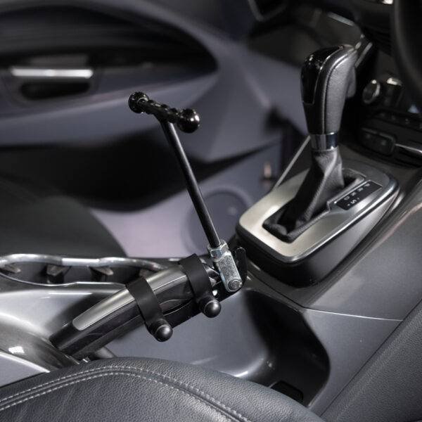 A car's handbrake with a minimalist T-shaped handle attached to it.