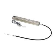 The mechanism of an electronic easy-release handbrake. A long, narrow silver box and a series of cables.