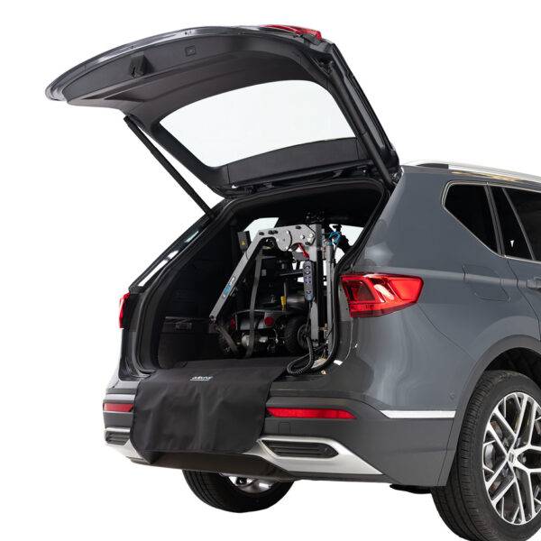 The open boot of a car showing a scooter loaded into the boot by the Autochair Smart Lifter LM folding Boot Hoist.