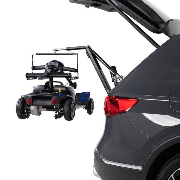 The open boot of a car with the Autochair Smart Lifter LC Boot Hoist lifting a mobility scooter. The scooter has the Autochair Smart Scooter seat installed. It has had the arms, seat cushion, lower frame, and backrest removed so it can be lifted more easily and fit the vehicle.