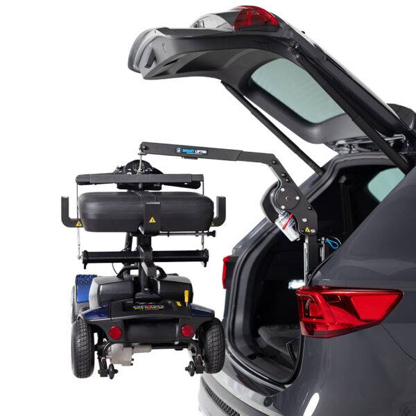 The open boot of a car with the Autochair Smart Lifter LM Folding Boot Hoist lifting a mobility scooter. The scooter has the Autochair Smart Scooter seat installed. It has had the arms and backrest removed so it can be lifted more easily and fit the vehicle.