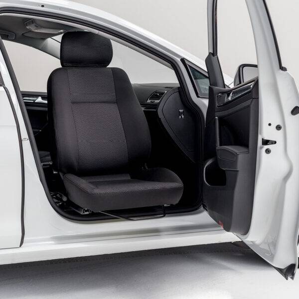 A swivel seat that has turned out of the driver's seat outside of the car to allow for easier access to the vehicle.