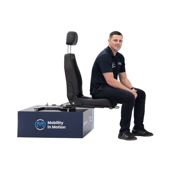 A Mobility in Motion assessor demonstrating the function of a swivel seat with a BraunAbility Turnout swivel base and the BEV seat.