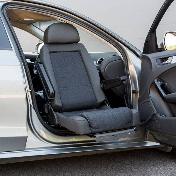 A swivel seat that has turned out of the driver's seat outside of the car to allow for easier access to the vehicle.