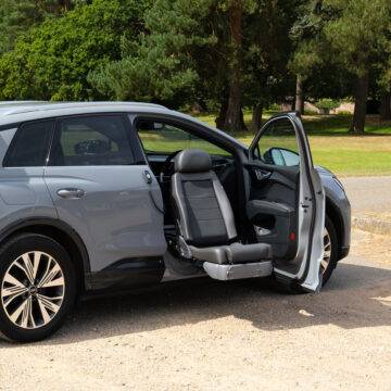 A swivel seat that has turned out of the driver's seat and lowered outside of the car to allow for easier access to the vehicle