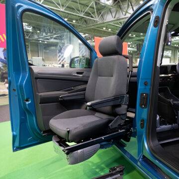 A swivel seat that has turned out of the passenger's seat and lowered outside of the car to allow for easier access to the vehicle