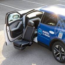 A swivel seat that has turned out of the passenger's seat and lowered outside of the car to allow for easier access to the vehicle