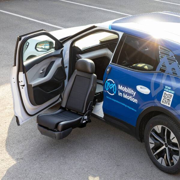 A swivel seat that has turned out of the passenger's seat and lowered outside of the car to allow for easier access to the vehicle