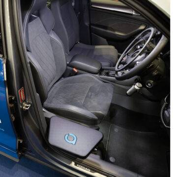 The Autochair Transfer Plate. A small black removable platform positioned next to the driver's seat of the car.