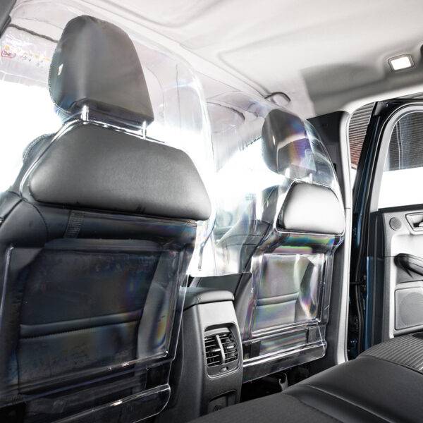 The rear seats of a car separated from the front passenger and driver by a robust transparent polycarbonate Driver shield for safely. The screen has additional padded panels to reduce the risk of injury.