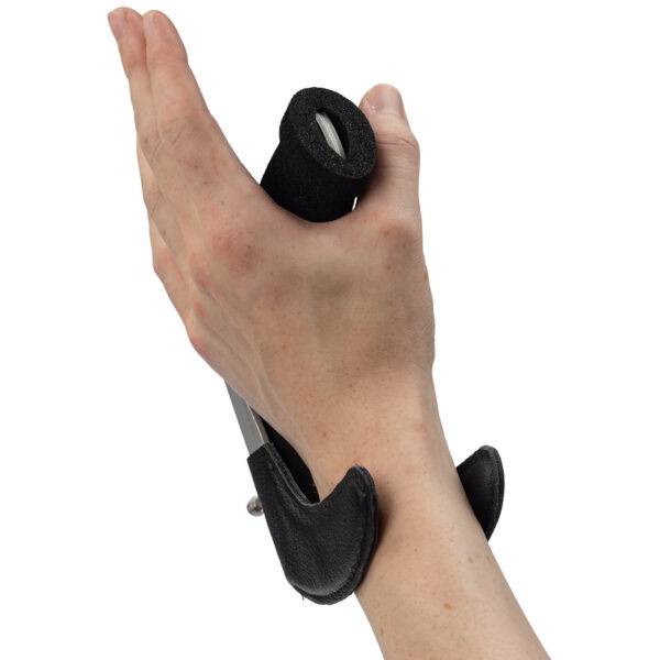 The quick-release specialist steering aid the BraunAbility 3-Pin Specialist Steering Aid. It is a soft foam handle perpendicular to the steering wheel with a supportive channel and two wrist pins to hold the hand and wrist comfortably in place.