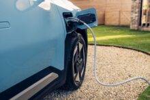 Close up of Kia EV3 with charger plugged in