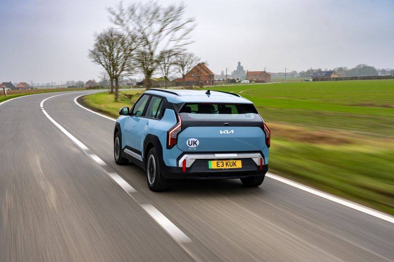 Light blue Kia ev3 on road